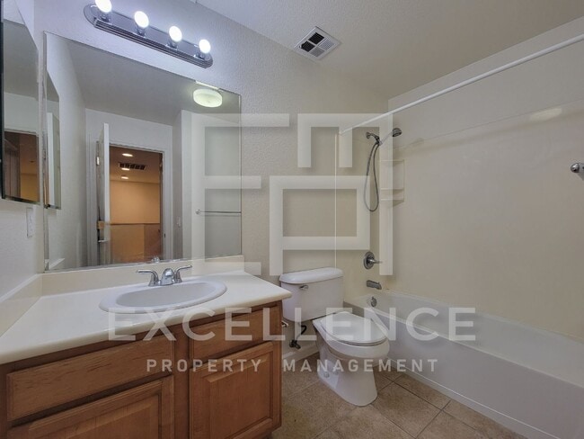 Building Photo - Spacious 3/2.5 Located In Communication Hills, With Two 1 Car Garages, W/D & Large Master Retreat