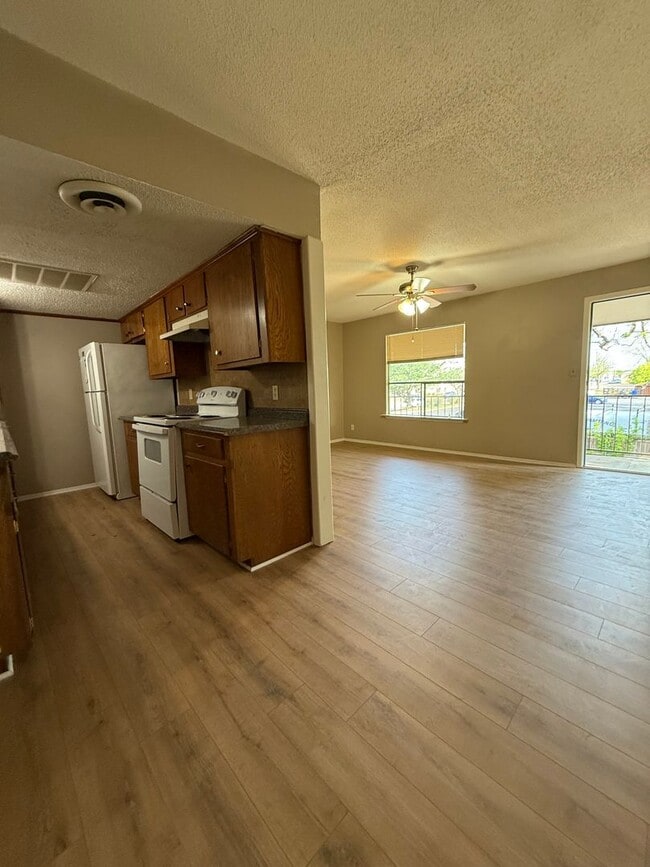 Building Photo - 1/1 NEW FLOORING ON-SITE LAUNDRY FACILITY-...