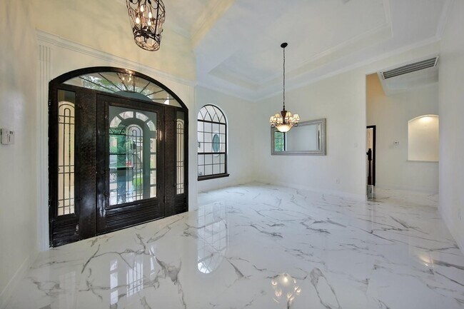 Building Photo - Beautiful Mediterranean Home In Gated Comm...