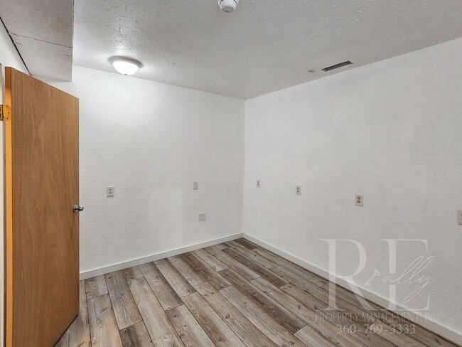 Building Photo - Vaulted Ceilings, Unique Designer Kitchen & Expansive Half-Acre Setting with Flexible Living Spaces