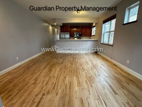 Building Photo - Spacious Uptown Side By Side, Dishwasher, Garage, In Unit Laundry, Private Rooftop Deck