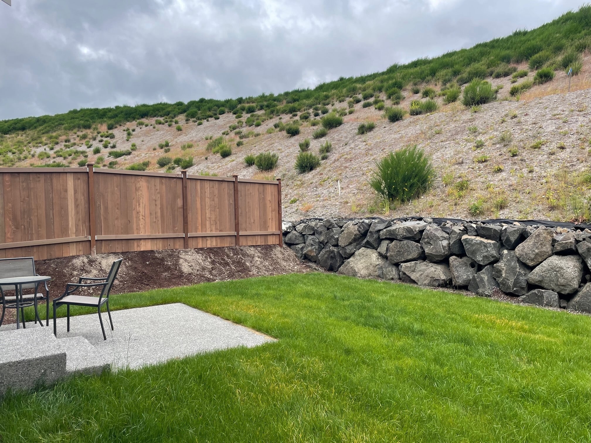 Private fenced rear yard with patio seating area - 5746 Waverly Rd SW