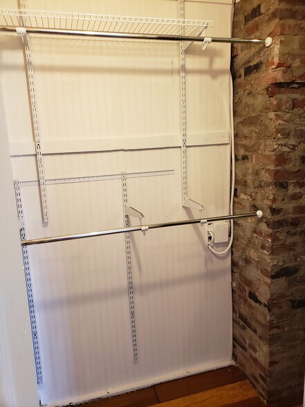 Two rods for hanging clothes and exposed chimney detail. - 10106 Wingfield Rd