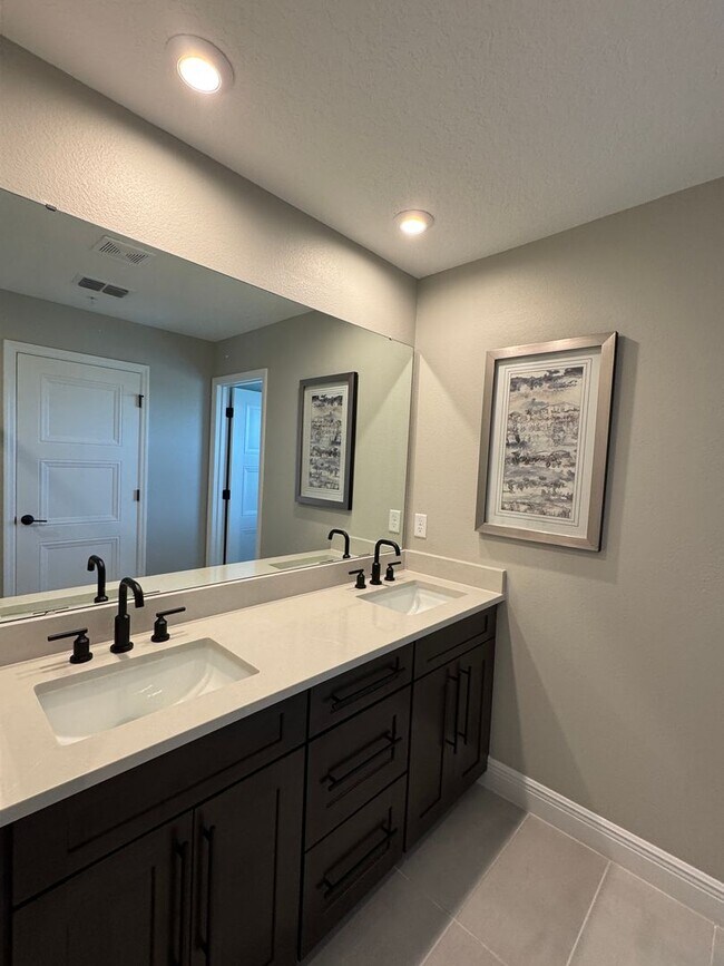 Building Photo - Elegant living in a vibrant, strategically located community—your perfect place to call home.