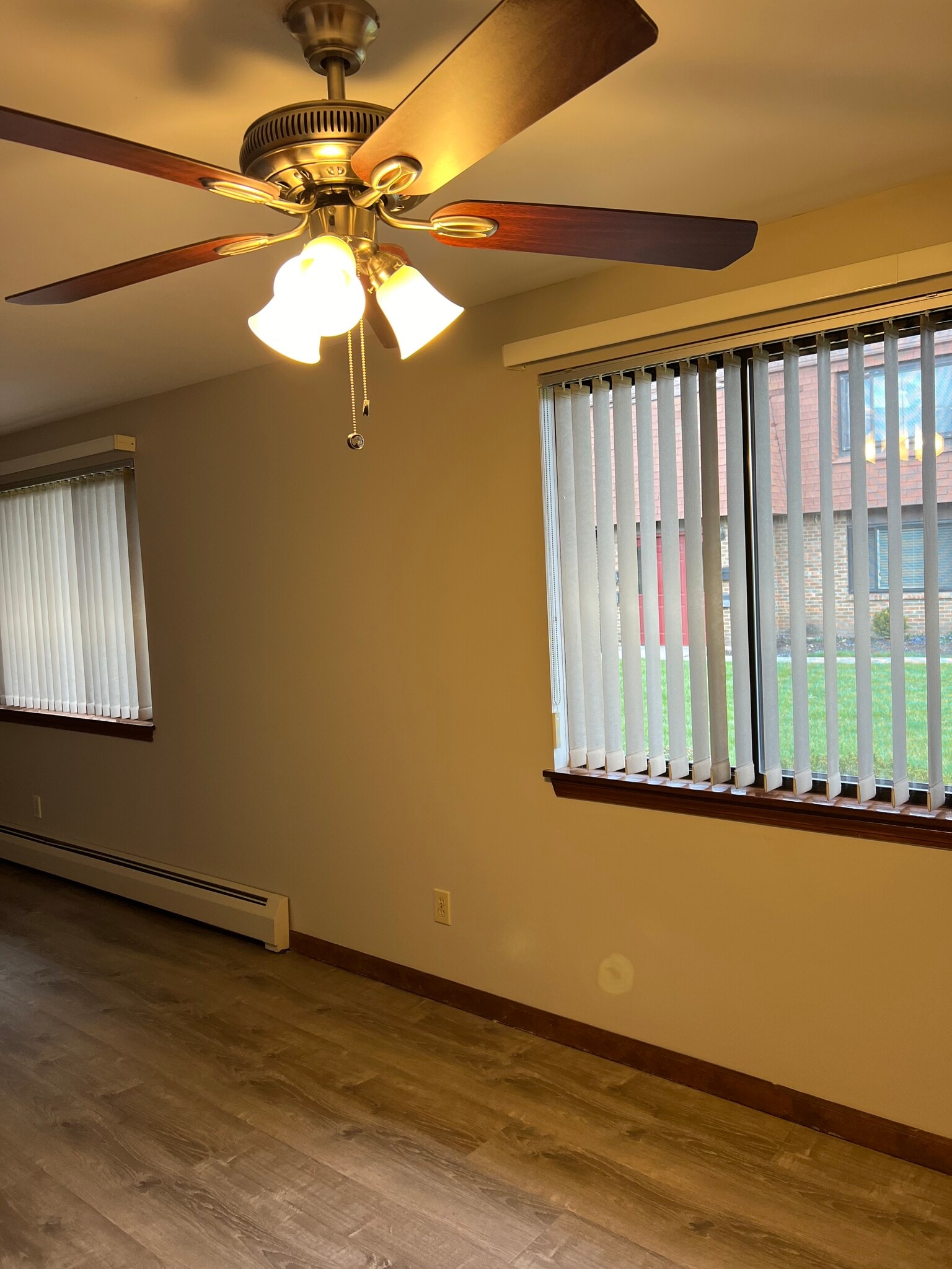 Dining area with vertical blinds included. - 3890 Ridge Lea Rd