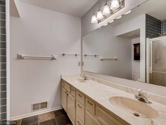 Double sinks in the Owner's Suite. - 7301 W 109th St