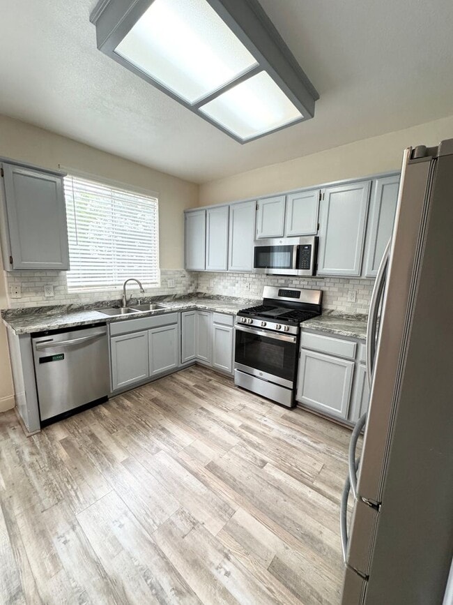 Building Photo - Spacious Solar-Powered 4-Bedroom, 3-Bath Home with Vaulted Ceilings & Tons of Storage! SEE VIDEO