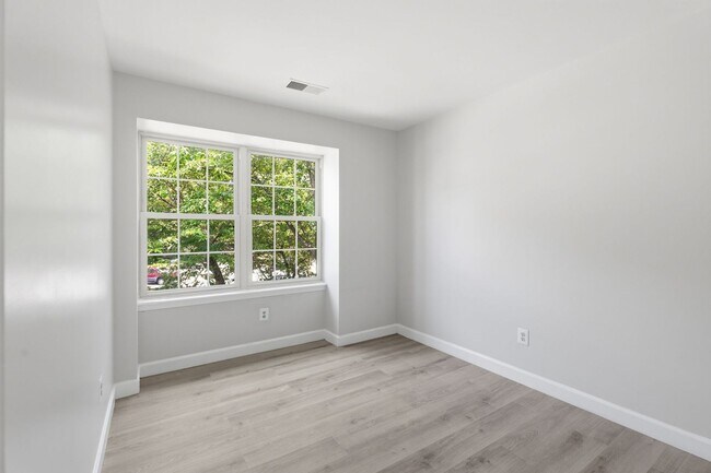Building Photo - Experience contemporary living in this beautifully renovated residence where modern design meets ...