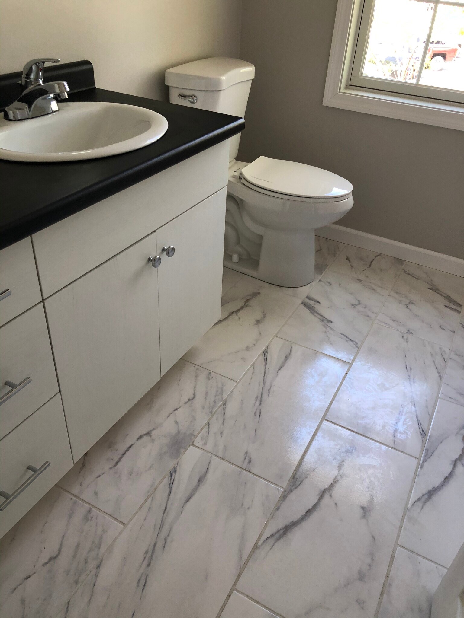 White tile floor in full bath - 697 Putnam Pike