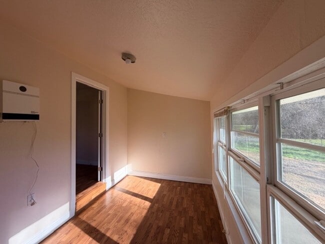 Building Photo - Charming 1 Bedroom Home with Bonus Room in a Serene, Secluded Setting