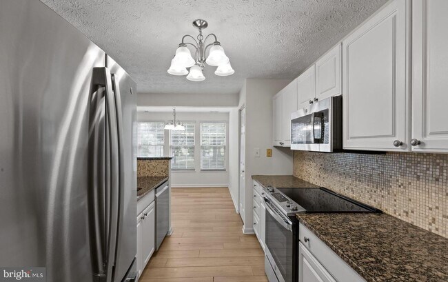 Building Photo - Welcome to Piney Orchard! This beautifully updated 2-bedroom, 2-bath condominium!