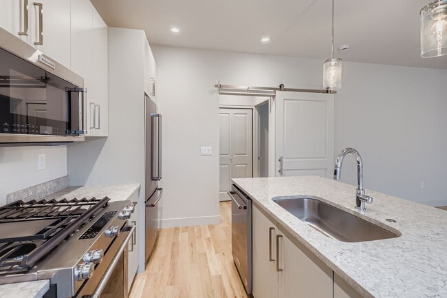 Building Photo - Swanky 1BR – New, Private Garage, Storage,...