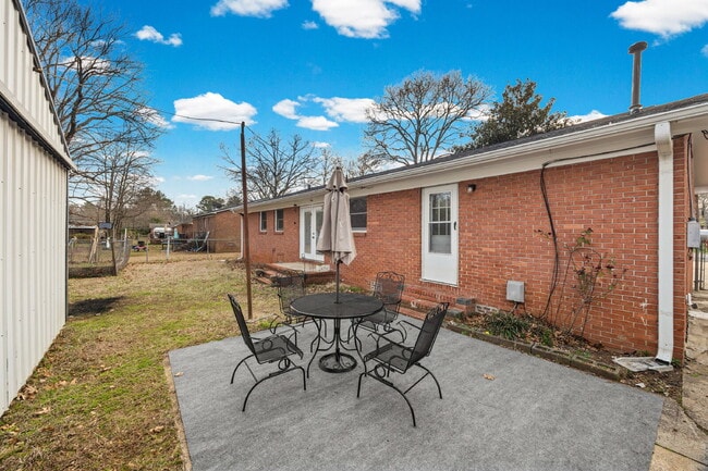 Building Photo - Classic Brick Ranch with 24x24 Workshop, Fenced Yard & Garden Beds