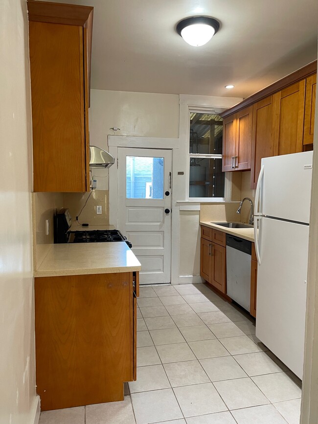 Here is the kitchen. This door leads outside to the deck area. - 286 19th Ave