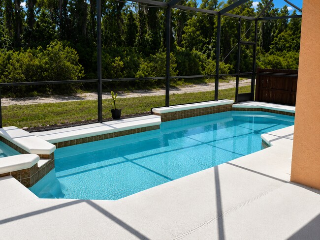 Building Photo - Freshly Painted 4BR/2BA Pool Home with Screened Pool & Spa – Move-In Ready!