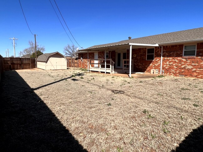 back patio/shed/storm shelter - 802 E Huber Ave