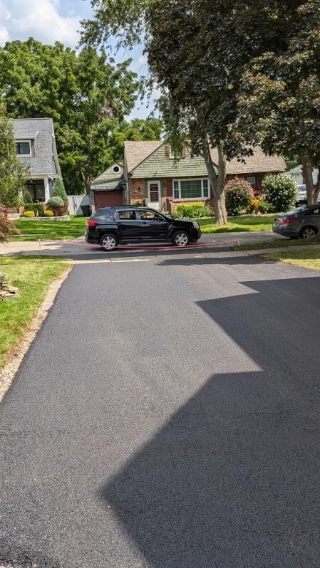 Long and Wide Driveway provides ample parking. - 61 Hirschfield Dr
