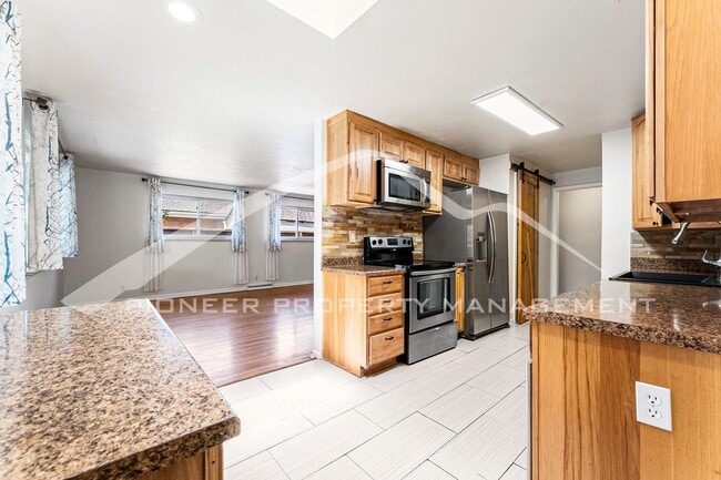 Building Photo - Spacious Home with Fenced Yard and Central AC