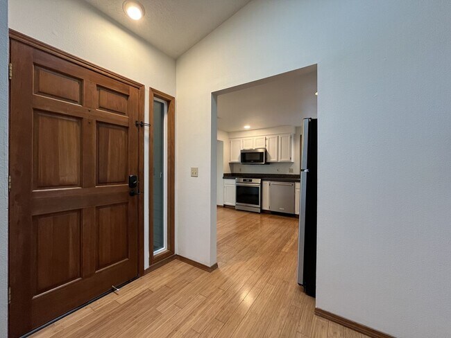 Building Photo - Spacious 3-Bedroom Home with Custom Stone Fireplace, Attached 2-Car Garage & Expansive Backyard i...