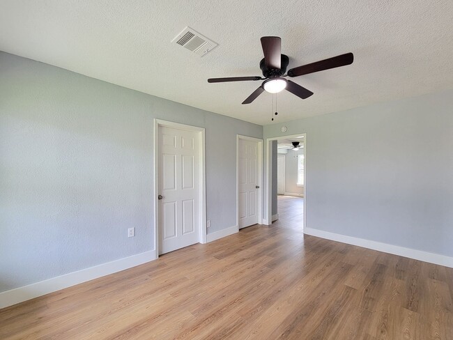 Building Photo - This beautifully updated 4-bedroom home is just under two miles from Highway 288 and Loop 610, ma...