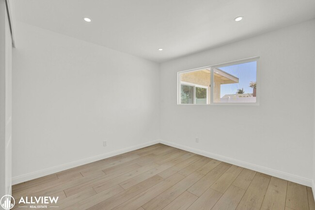 Building Photo - Fully Renovated 4-Bedroom Home with Firepl...