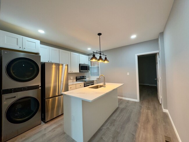 Building Photo - Spacious 4-Bedroom Townhome with Modern Amenities in Baltimore!