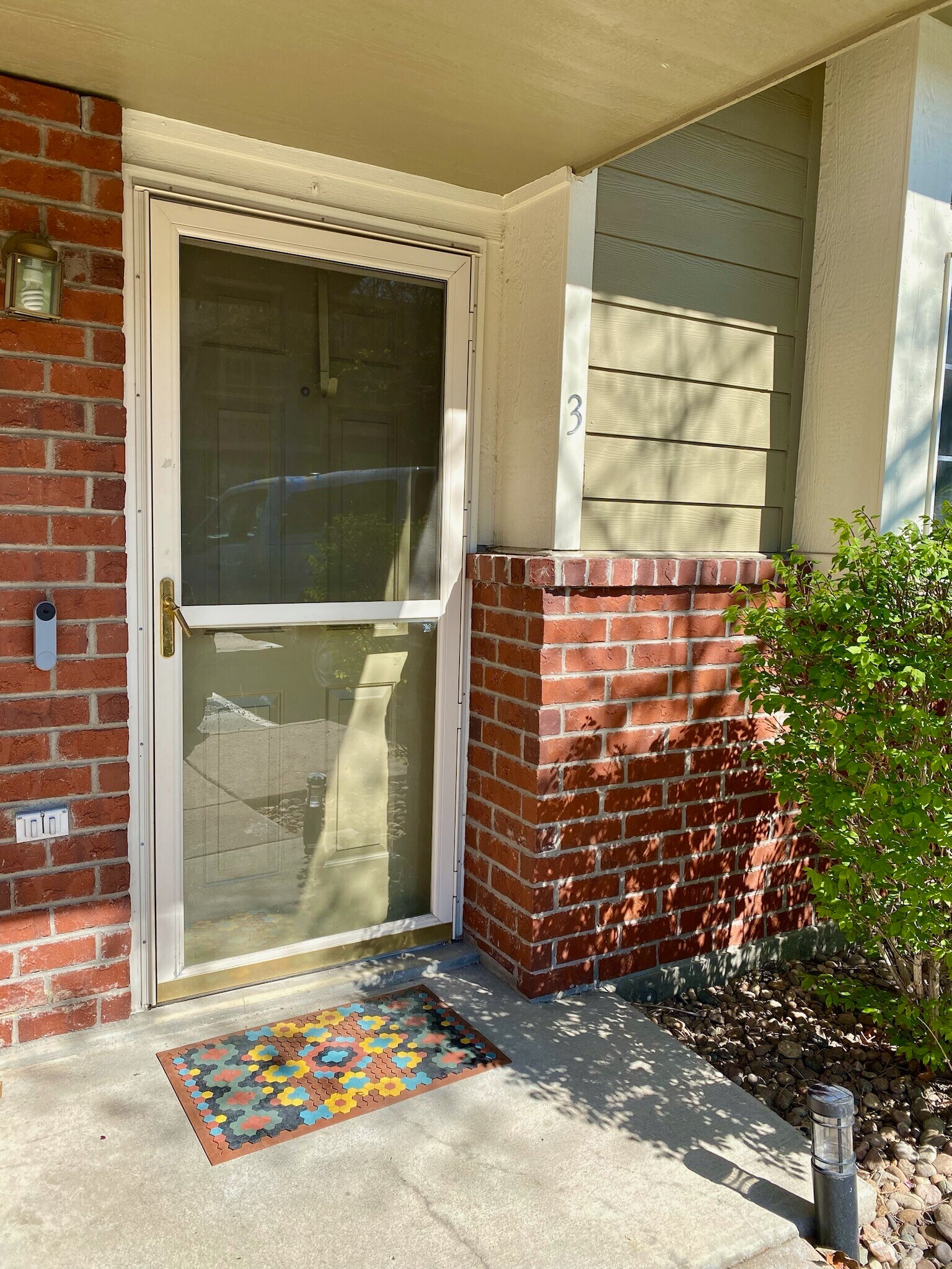Front door with Nest video doorbell and locking storm dorm - 9056 Gale Blvd