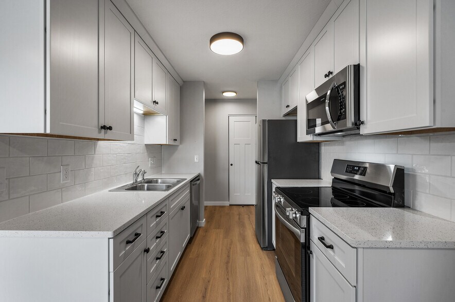 New kitchen with SS Appliances and stone countertops. - 1551 Namekagon St