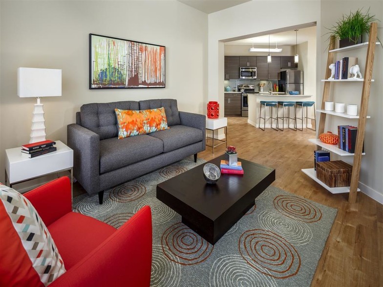 Living room with kitchen view, wood-style flooring, and cable ready - Thirty Oaks