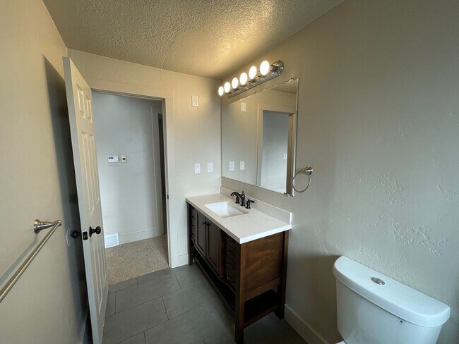 Building Photo - Spacious 6-Bedroom Magna Home with Fenced Yard