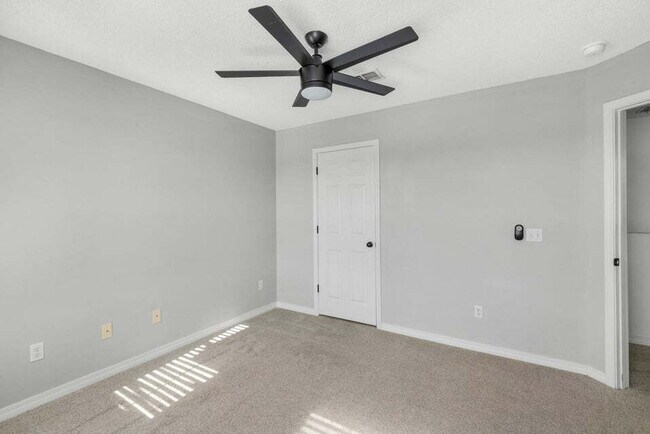Building Photo - LAKE FRONT HOME & GATED COMMUNITY WITH COMMUNITY POOL IN NAVARRE!