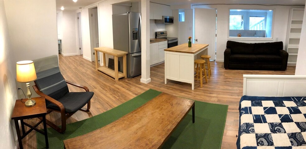 View of kitchen with hallway to bedroom/bathroom on left - 2415 E 12th St