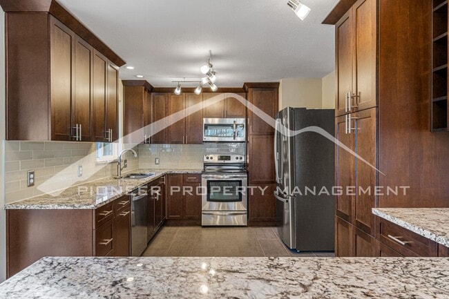 Building Photo - Spacious Home with Natural Light & Fenced Backyard