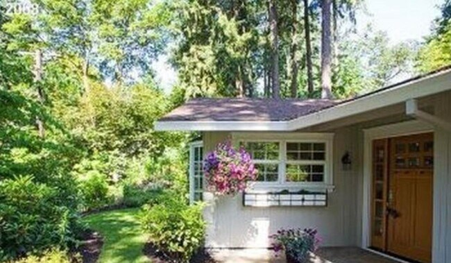 Building Photo - Spacious & light filled home with a garage, backyard, storage & hardwood floors throughout