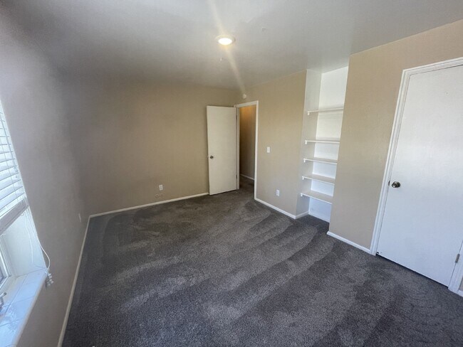 Building Photo - Spacious 6-Bed Oasis with Finished Basement & Cozy Fireplace.