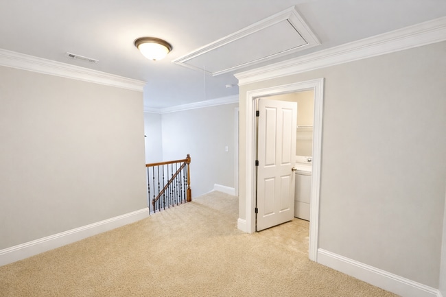 Building Photo - Gated Johns Creek Townhome Offering Space, Privacy, and Everyday Convenience