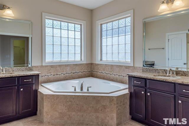 Building Photo - Beautiful 4-Bedroom Stone Front Home in Prime West Cary Location with Fenced Backyard & Resort-St...