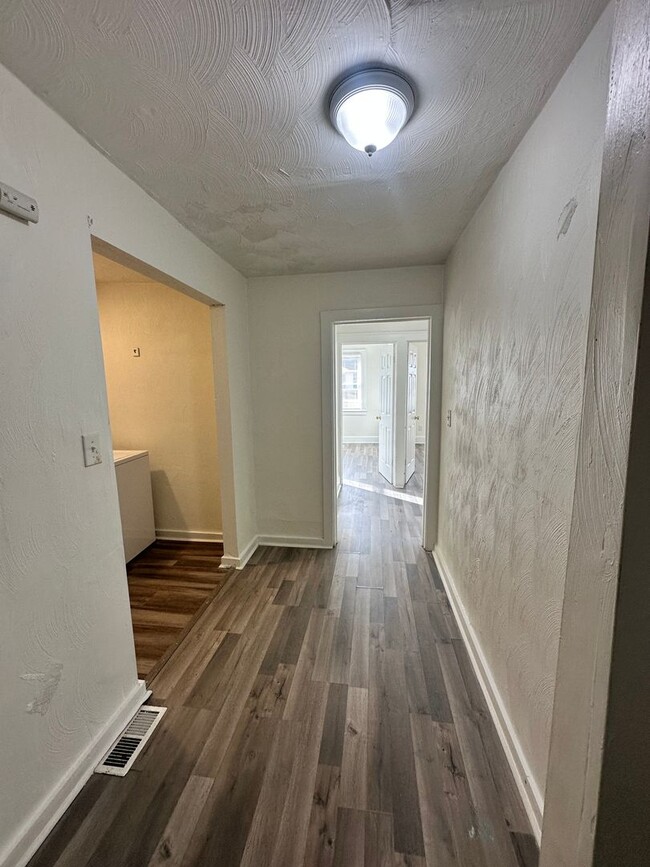 Building Photo - Three Bedroom Available Soon!