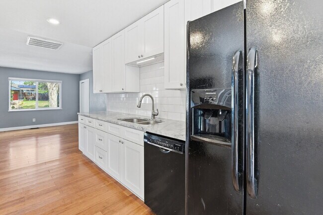 Building Photo - $3,045.95, 3 bed, 2 bath house in Denver with Fenced in Yard and In Unit Laundry!