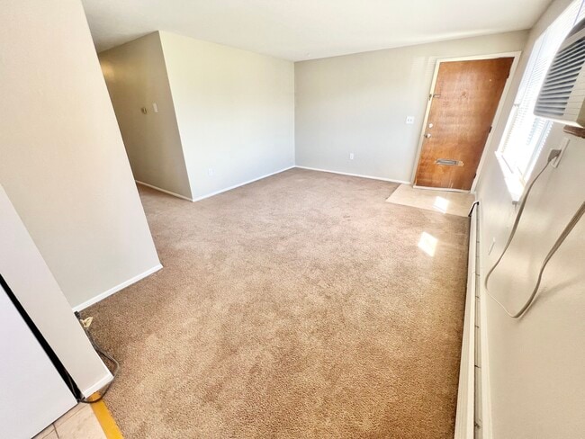 Step into comfort with this welcoming entrance space, perfect for creating your dream living area. - Westland Apartments