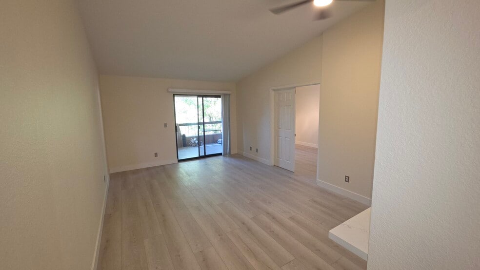 Living space toward patio and 2nd bedroom - 1351 N Pleasant Dr