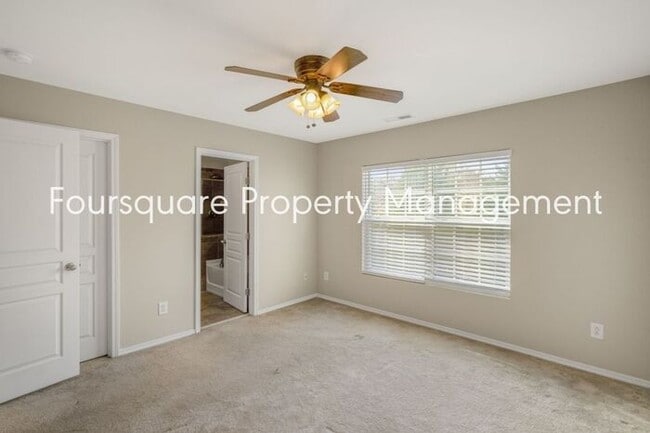 Building Photo - Charming Townhome with Open Layout, Back Patio & One-Car Garage – Near RTP, RDU & Everyday Conven...