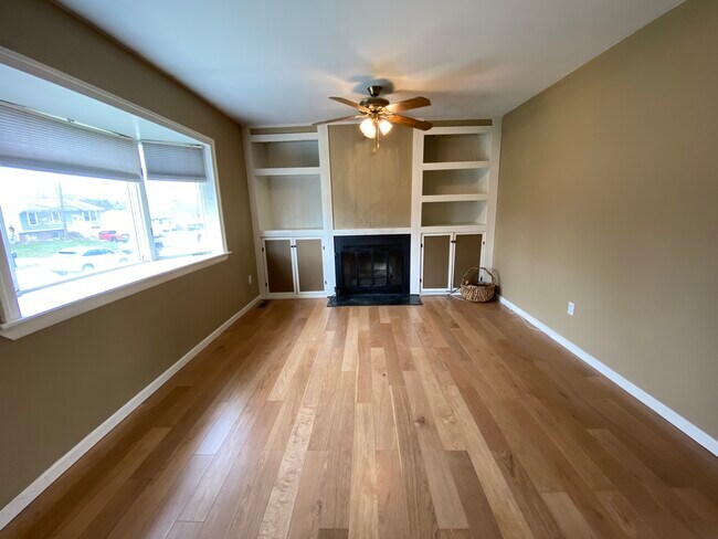 Living/Family Room with working fireplace and great built-in shelving - 618 Clayton Ave NW