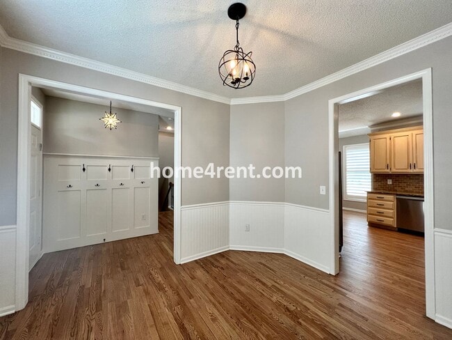 Building Photo - Updated Kitchen, Large Two Tiered Deck, Finished Basement in Blue Valley Schools!