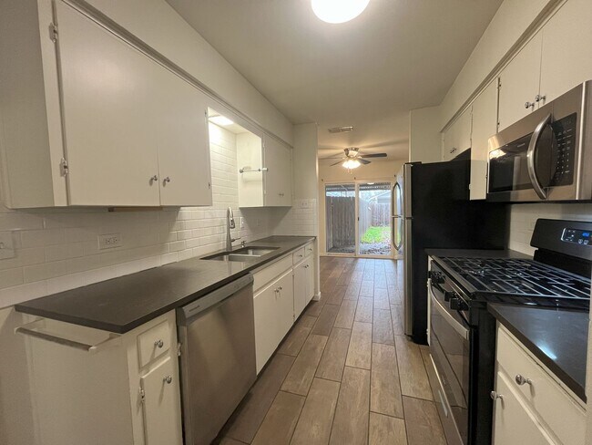 Building Photo - 2/2 WITH TWO Car Garage in GREAT Location