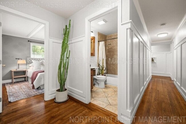 Building Photo - Welcome to this stunning 4-bedroom, 2-bath...