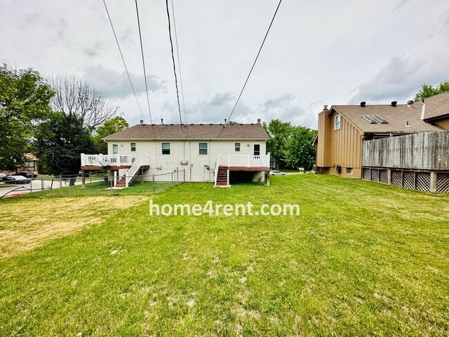 Building Photo - Updated Kitchen, Composite Deck and Refrig...