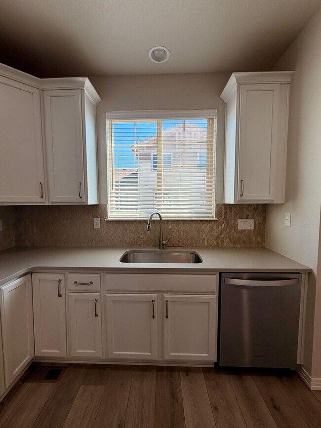 Building Photo - Move-In Ready 3-Story Townhome with Loft & 2-Car Garage