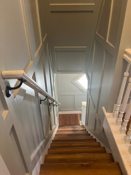 1st to 2nd floor steps, looking down to front door entrance - 715 Cattell St