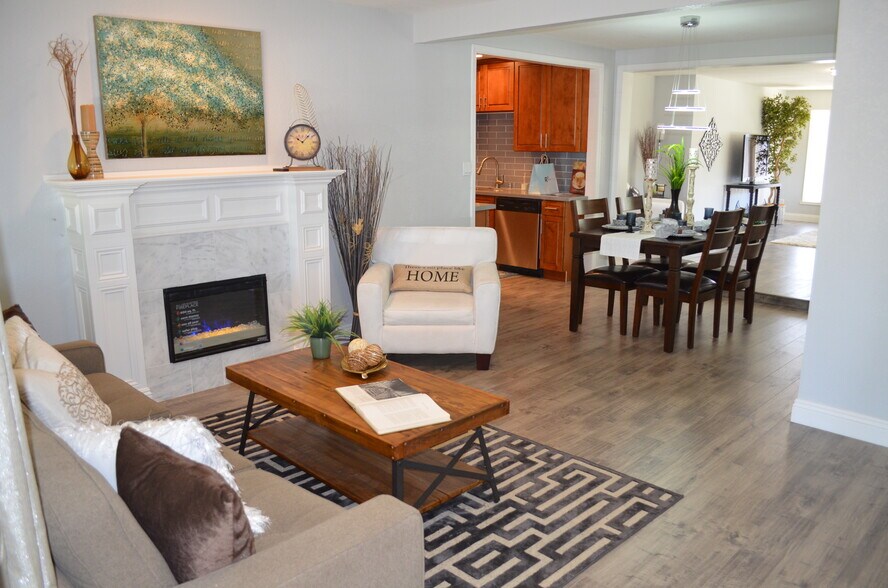 Formal Living with Fireplace &amp; Dining area view - 2355 Geraldine Dr